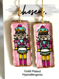 Nutcracker Hand Painted Leather Earring Collection: Pink-Dark Skin Tone-Gold plated frames and hooks