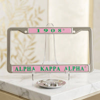 Alpha Kappa Alpha 1908 License Plate Frame: Pink and Green / Rhodium / 6.25 x 12.25 inches