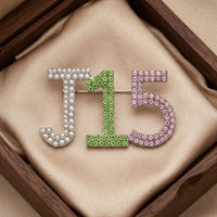 Alpha Kappa Alpha J15 Pearl Rhinestone Brooch: Pink and Green / Rhodium / 1 x 1.85 inches