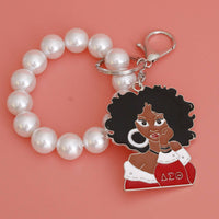 DELTA Red White Woman Pearl Keychain: 7.85 x 2.25 inches / Red and White / Rhodium